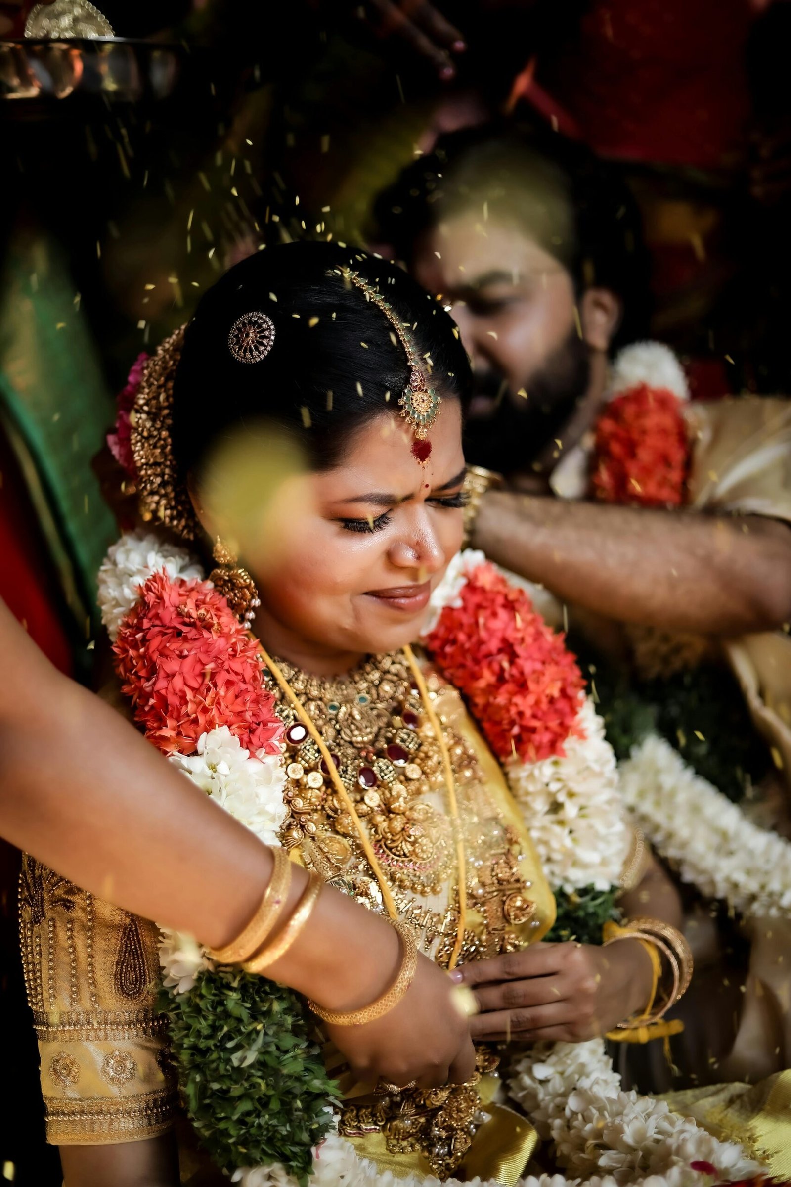 A vibrant and emotional moment captured during a traditional Indian wedding in Tiruchirappalli, India.